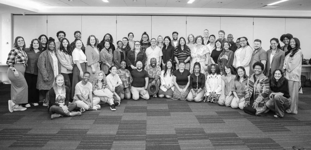 The Management Center staff in 2025. About 60 people smiling at the camera.